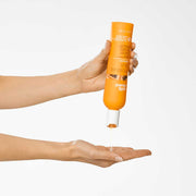 milk-shake-moisture-plus-shampoo-in-hand